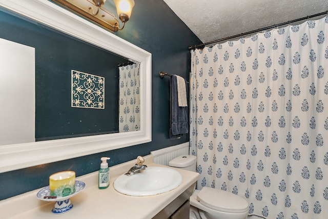 911 N 9th St, Dekalb, IL 60115 - bathroom with vanity, a textured ceiling, and curtained shower