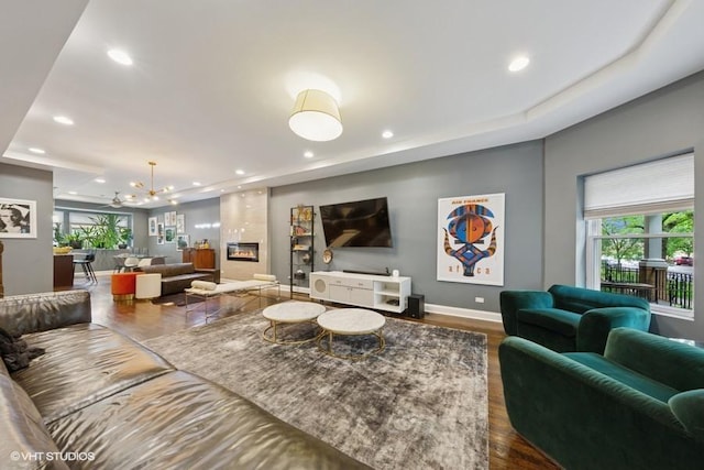 4229 S Prairie Ave, Chicago, IL 60653 - living area with recessed lighting, a tray ceiling, a chandelier, and a fireplace