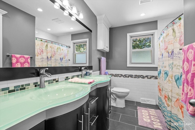 92 Neil Rd, Sugar Grove, IL 60554 - full bathroom with vanity, tile walls, healthy amount of natural light, recessed lighting, and a wainscoted wall