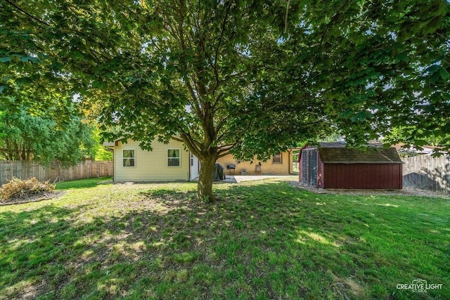 92 Neil Rd, Sugar Grove, IL 60554 - fenced backyard featuring a storage unit and a patio