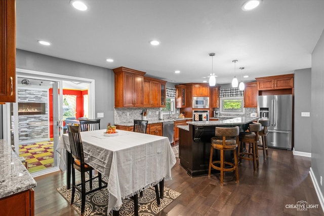 92 Neil Rd, Sugar Grove, IL 60554 - kitchen featuring stainless steel appliances, tasteful backsplash, brown cabinetry, recessed lighting, and dark wood-type flooring