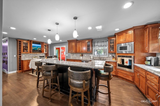 92 Neil Rd, Sugar Grove, IL 60554 - kitchen with stainless steel appliances, brown cabinets, tasteful backsplash, recessed lighting, and dark wood-style floors