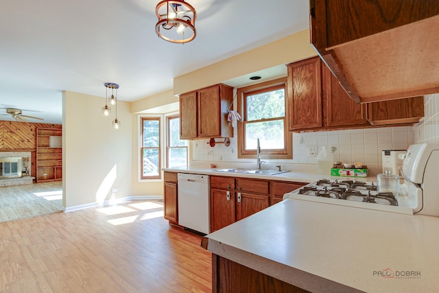 1021 Autumn Dr, Antioch, IL 60002 - kitchen with white appliances, light wood-style floors, tasteful backsplash, and range hood