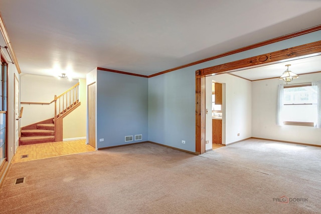 1021 Autumn Dr, Antioch, IL 60002 - carpeted spare room with stairway and ornamental molding