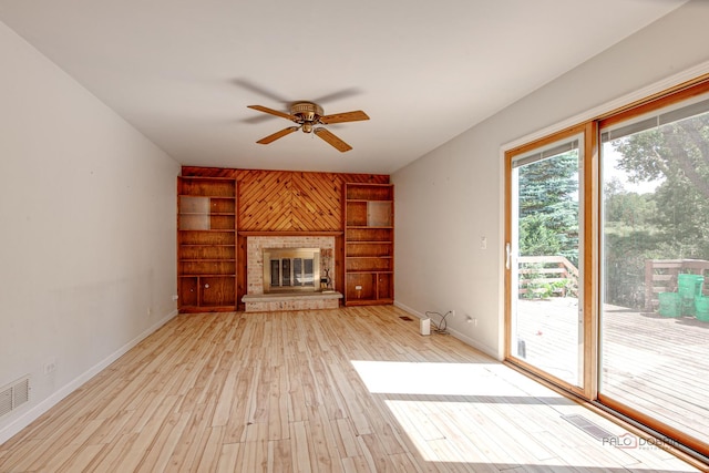 1021 Autumn Dr, Antioch, IL 60002 - unfurnished living room with a ceiling fan, a glass covered fireplace, and wood finished floors