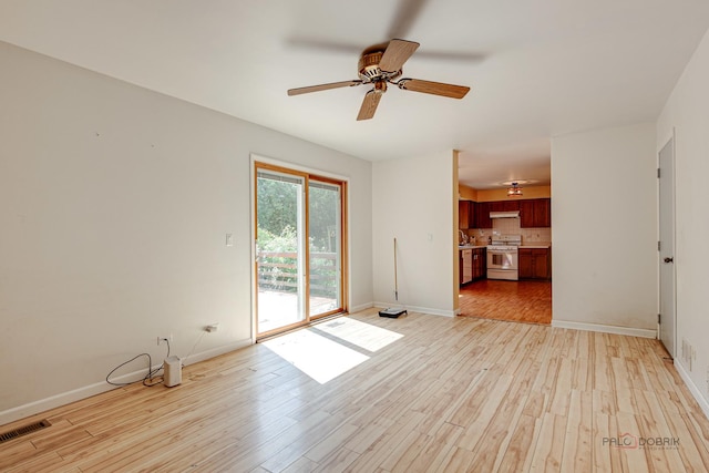 1021 Autumn Dr, Antioch, IL 60002 - unfurnished living room with light wood-type flooring and a ceiling fan