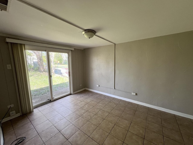 252 Mantua St, Park Forest, IL 60466 - empty room featuring light tile patterned floors and baseboards