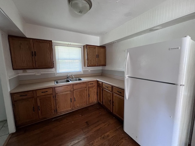 252 Mantua St, Park Forest, IL 60466 - kitchen featuring freestanding refrigerator, dark wood finished floors, brown cabinetry, and light countertops