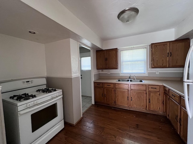 252 Mantua St, Park Forest, IL 60466 - kitchen with white appliances, dark wood-style flooring, light countertops, and brown cabinets