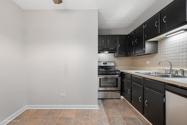 5340 Waterbury Ct Unit 2103, Crestwood, IL 60418 - kitchen featuring stainless steel gas range oven, dishwashing machine, under cabinet range hood, dark cabinetry, and tasteful backsplash