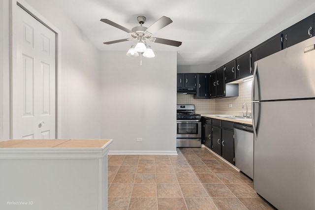 5340 Waterbury Ct Unit 2103, Crestwood, IL 60418 - kitchen with stainless steel appliances, dark cabinets, extractor fan, and a ceiling fan