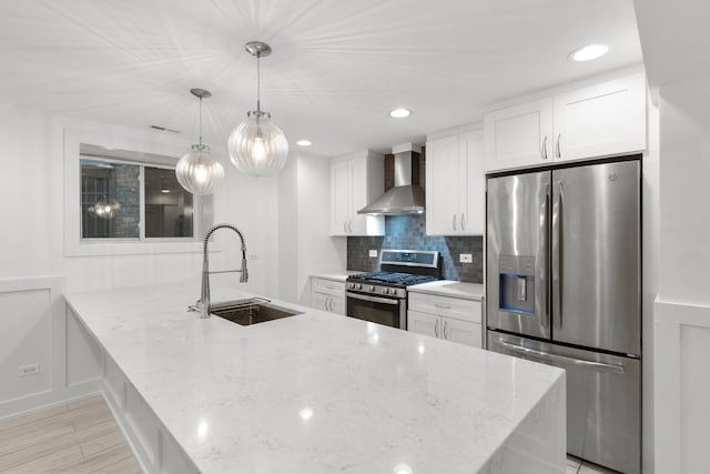 5312 S Woodlawn Ave Unit 1, Chicago, IL 60615 - kitchen with appliances with stainless steel finishes, wall chimney range hood, white cabinets, tasteful backsplash, and light stone countertops