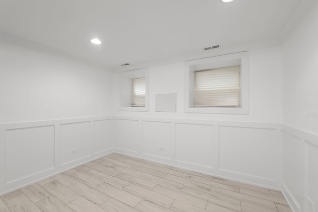 5312 S Woodlawn Ave Unit 1, Chicago, IL 60615 - empty room featuring a decorative wall, recessed lighting, and a wainscoted wall