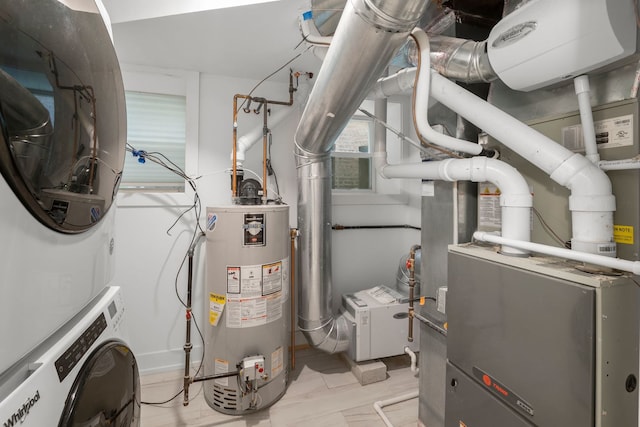 5312 S Woodlawn Ave Unit 1, Chicago, IL 60615 - utilities with stacked washer / dryer and water heater