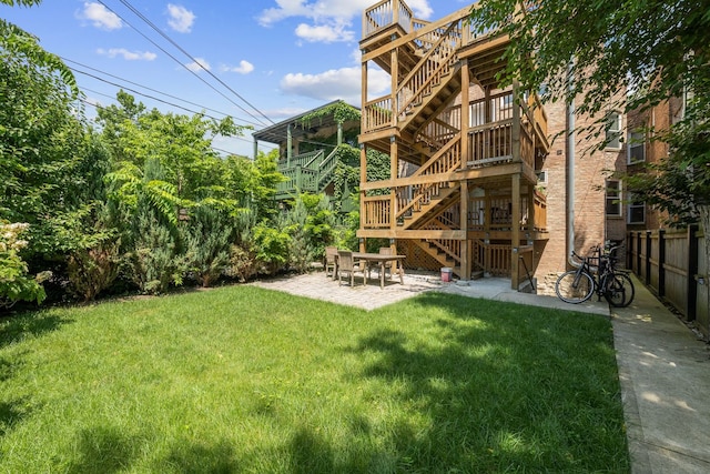5312 S Woodlawn Ave Unit 1, Chicago, IL 60615 - back of house featuring stairs, a patio area, and a deck