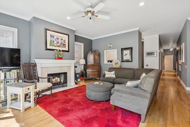 2848 N Burling St Unit 1, Chicago, IL 60657 - living area with wood finished floors, a ceiling fan, ornamental molding, a tile fireplace, and recessed lighting