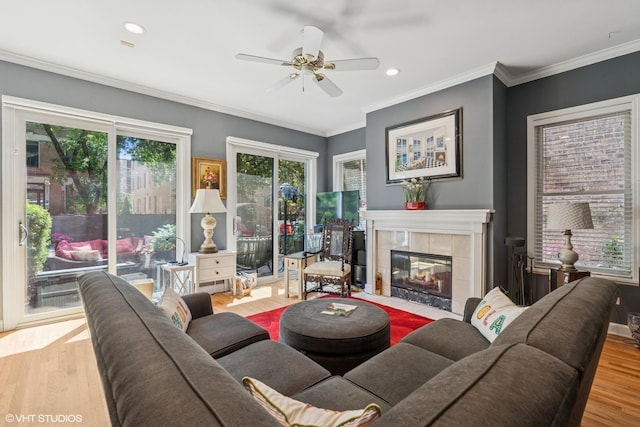 2848 N Burling St Unit 1, Chicago, IL 60657 - living room with wood finished floors, a fireplace, ceiling fan, ornamental molding, and recessed lighting