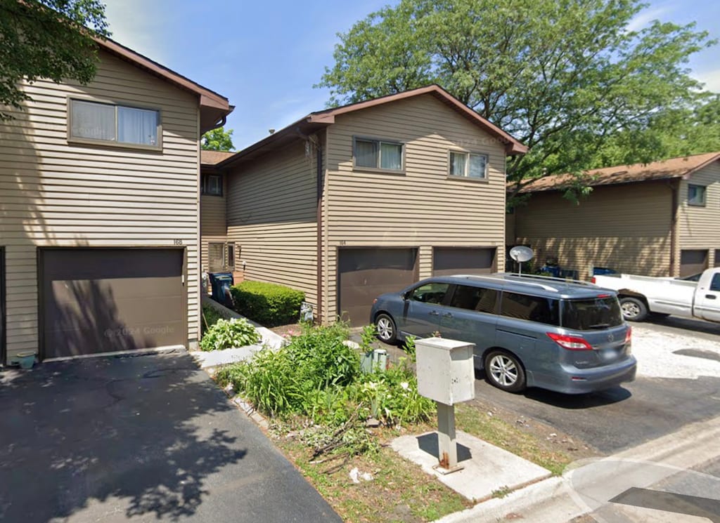 164 S Ruga Ct, Addison, IL 60101 - view of front of property with a garage