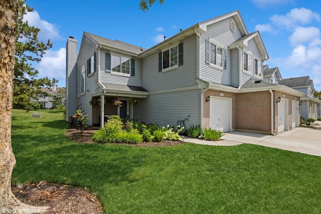253 Sierra Pass, Schaumburg, IL 60194 - view of front of property with a chimney, brick siding, a front lawn, concrete driveway, and a garage