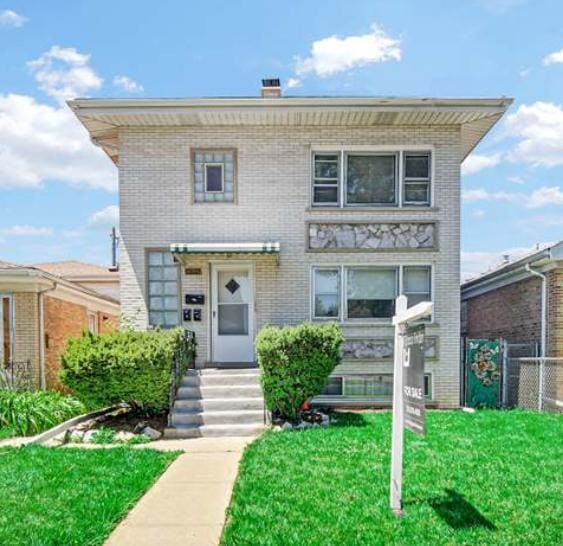 2924 N Mulligan Ave, Chicago, IL 60634 - view of front of property featuring brick siding and a chimney