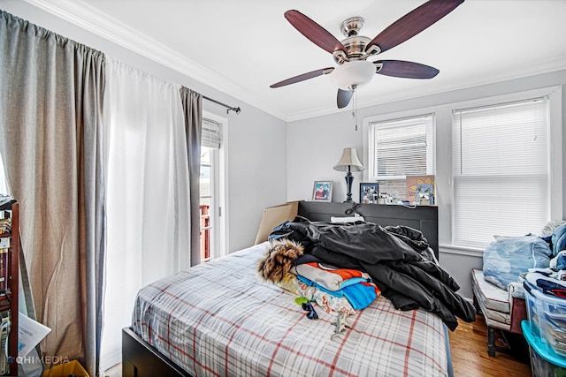 2924 N Mulligan Ave, Chicago, IL 60634 - bedroom with crown molding, wood finished floors, and ceiling fan