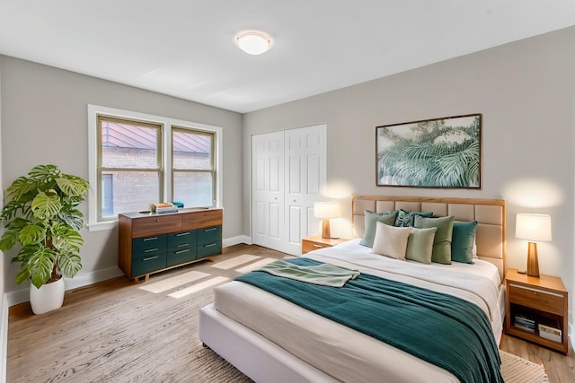 10026 S Spaulding Ave, Evergreen Park, IL 60805 - bedroom featuring light wood-style flooring and a closet