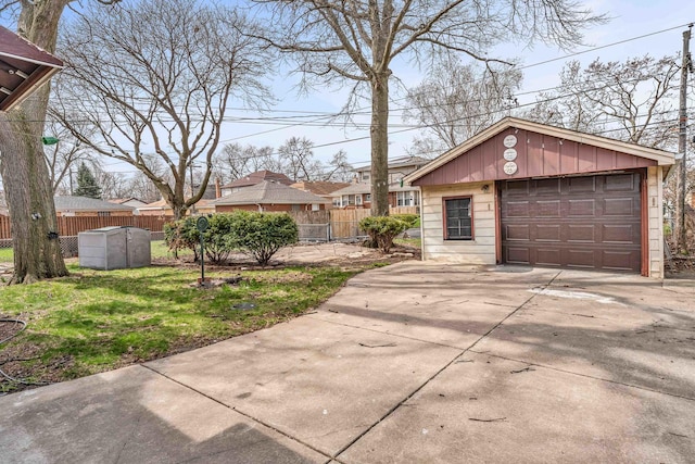 10026 S Spaulding Ave, Evergreen Park, IL 60805 - view of yard featuring concrete driveway, a detached garage, and an outdoor structure