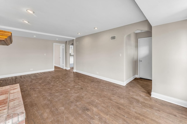 10026 S Spaulding Ave, Evergreen Park, IL 60805 - spare room featuring arched walkways, recessed lighting, and wood finished floors
