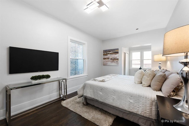 4846 W Roscoe St, Chicago, IL 60641 - bedroom featuring dark wood-type flooring and baseboards