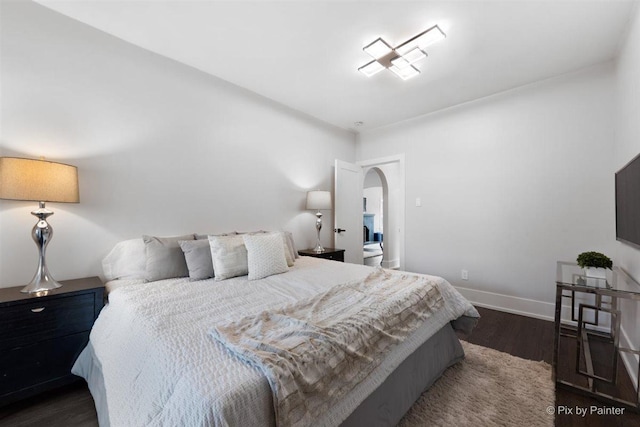 4846 W Roscoe St, Chicago, IL 60641 - bedroom featuring arched walkways and wood finished floors