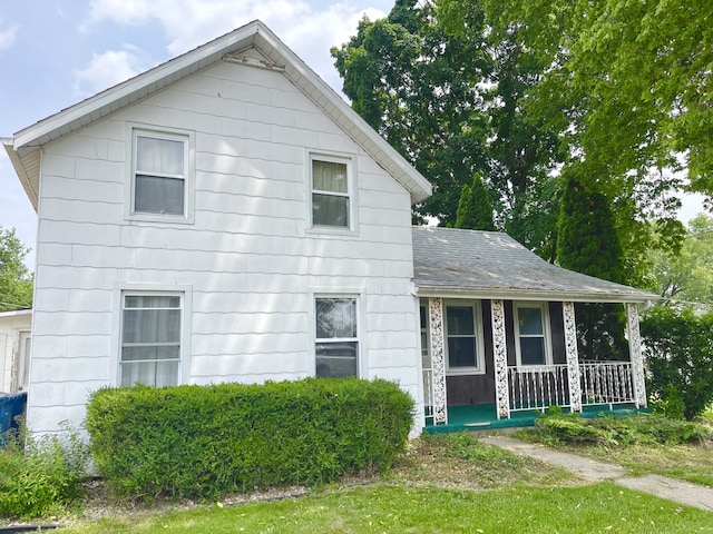 218 S Oneca St, Tonica, IL 61370 - view of front facade featuring a porch and a shingled roof