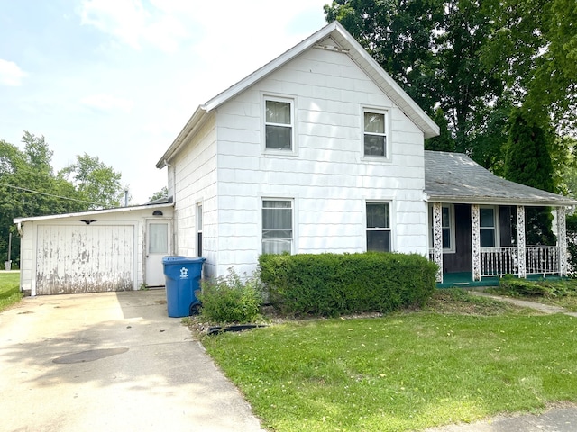 218 S Oneca St, Tonica, IL 61370 - traditional home with covered porch, a front yard, and driveway