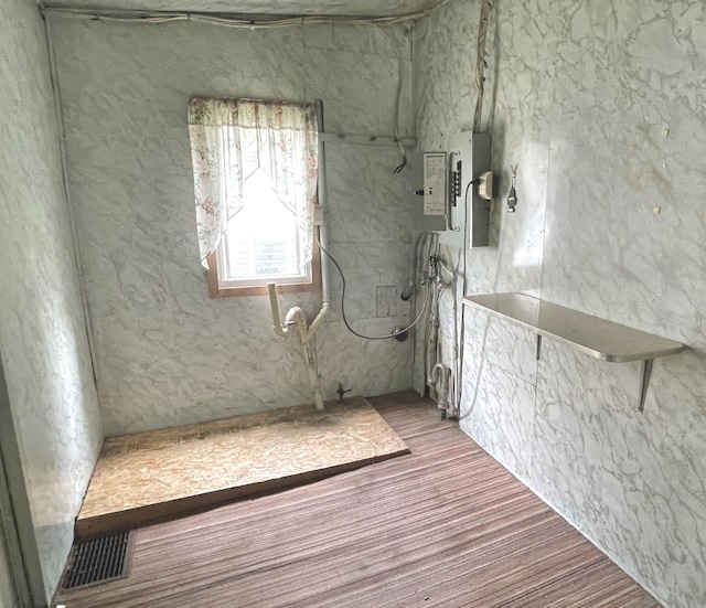 218 S Oneca St, Tonica, IL 61370 - basement featuring wood finished floors and electric panel