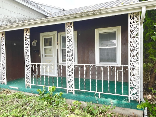 218 S Oneca St, Tonica, IL 61370 - view of exterior entry with a porch and roof with shingles