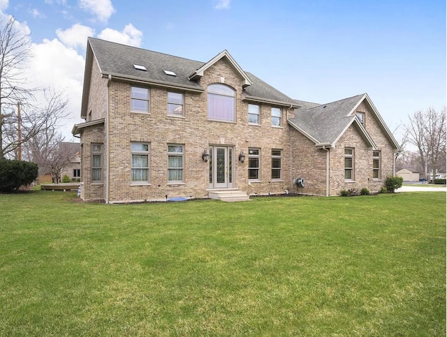 115 E Woodlawn Rd, New Lenox, IL 60451 - back of house with brick siding, a yard, and roof with shingles
