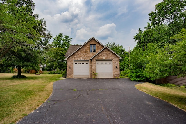 115 E Woodlawn Rd, New Lenox, IL 60451 - view of front of property with brick siding, a detached garage, and a front lawn