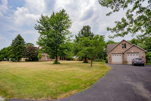 115 E Woodlawn Rd, New Lenox, IL 60451 - view of green lawn featuring a garage and driveway