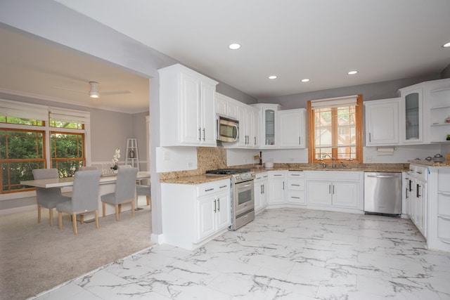 115 E Woodlawn Rd, New Lenox, IL 60451 - kitchen with appliances with stainless steel finishes, recessed lighting, healthy amount of natural light, light stone counters, and white cabinets