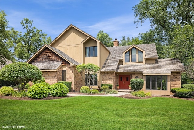 11522 Ridgewood Ln, Burr Ridge, IL 60527 - view of front facade with a front yard, brick siding, and a chimney