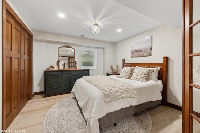 11522 Ridgewood Ln, Burr Ridge, IL 60527 - bedroom featuring recessed lighting, light wood-style flooring, and a closet