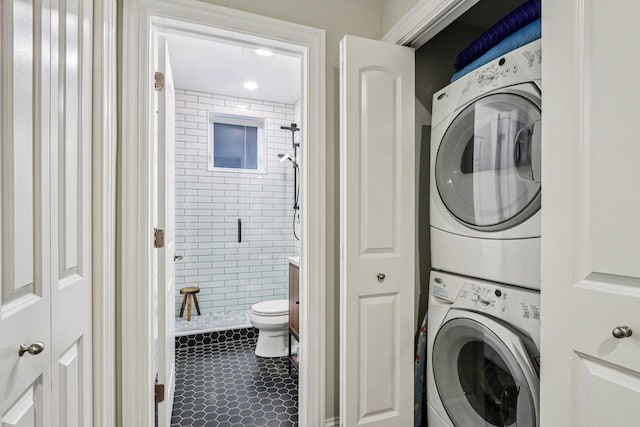 1431 N Artesian Ave Unit 1, Chicago, IL 60622 - laundry room featuring stacked washer and clothes dryer and tile patterned flooring