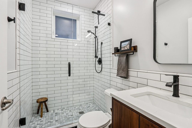 1431 N Artesian Ave Unit 1, Chicago, IL 60622 - bathroom featuring a stall shower, vanity, tile walls, and a wainscoted wall