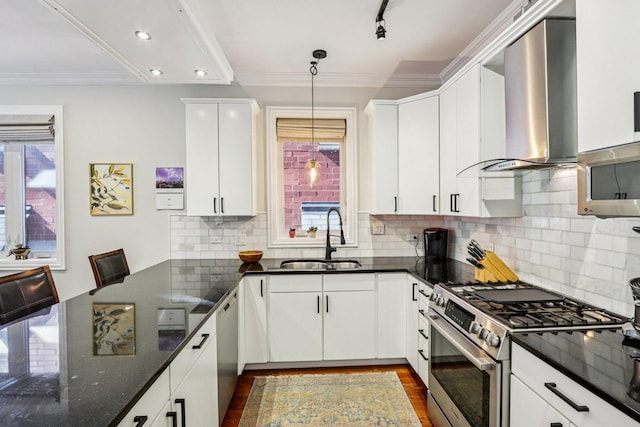 1431 N Artesian Ave Unit 1, Chicago, IL 60622 - kitchen featuring appliances with stainless steel finishes, wall chimney exhaust hood, dark wood-style flooring, pendant lighting, and white cabinetry