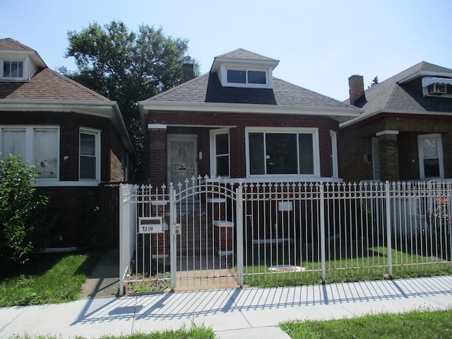 7319 S Claremont Ave, Chicago, IL 60636 - bungalow with a fenced front yard, brick siding, a gate, and a chimney