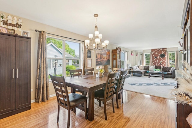 1192 Sumac Trl, Hoffman Estates, IL 60192 - dining room with light wood-style floors and a chandelier