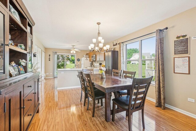 1192 Sumac Trl, Hoffman Estates, IL 60192 - dining space with a chandelier, light wood-type flooring, and a ceiling fan