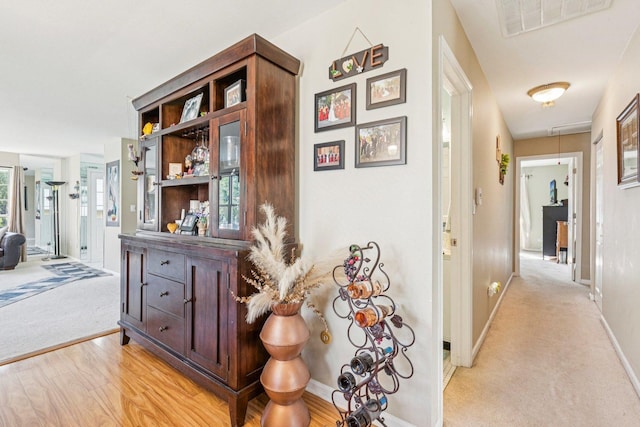 1192 Sumac Trl, Hoffman Estates, IL 60192 - corridor featuring light carpet, attic access, and light wood-type flooring