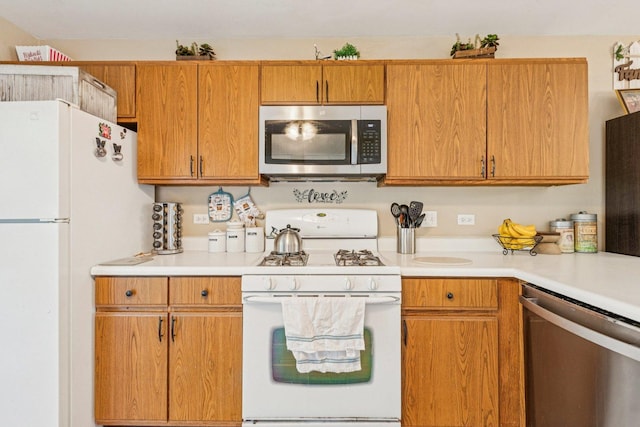 1192 Sumac Trl, Hoffman Estates, IL 60192 - kitchen with stainless steel appliances, light countertops, and brown cabinetry