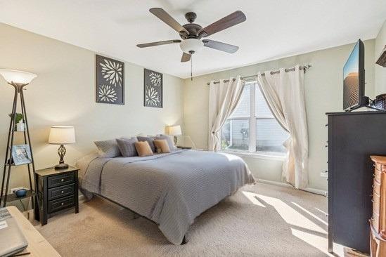 1192 Sumac Trl, Hoffman Estates, IL 60192 - bedroom featuring light carpet and a ceiling fan