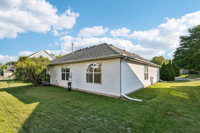1192 Sumac Trl, Hoffman Estates, IL 60192 - back of property with a lawn and a shingled roof